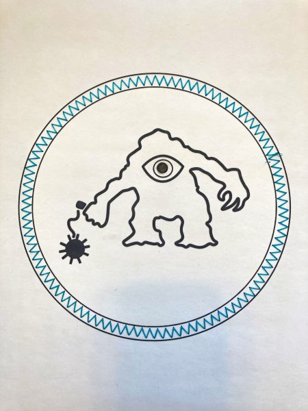 The entire interactive interpretation of the CIC patch. The monster and circular border are printed in microcapsule on paper. There is a blue zigzag stitch encircling the monster.